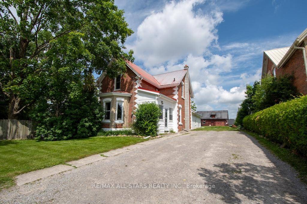 Beautiful brick century home, with a lovely private yard !