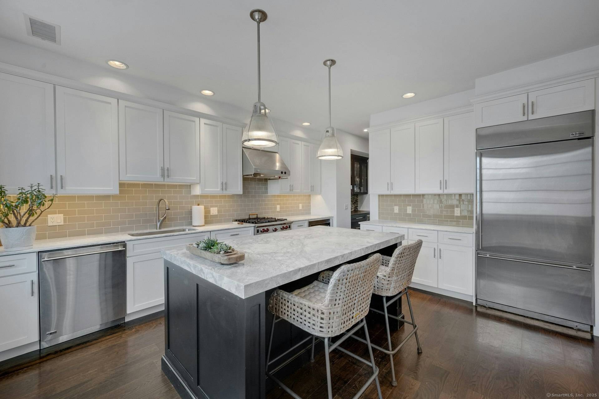 This custom, meticulously maintained 3 bedroom, 3.