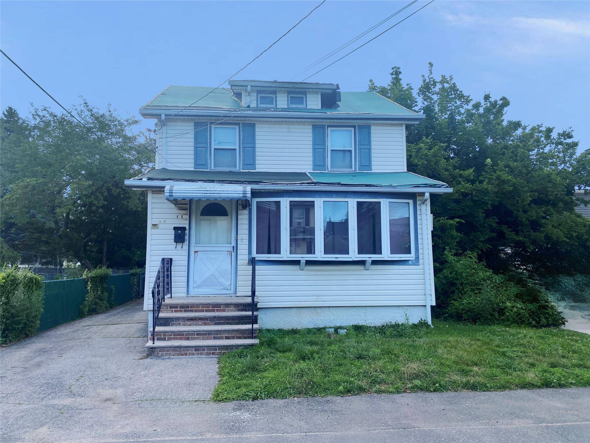 Spacious detached colonial with private driveway and garage.