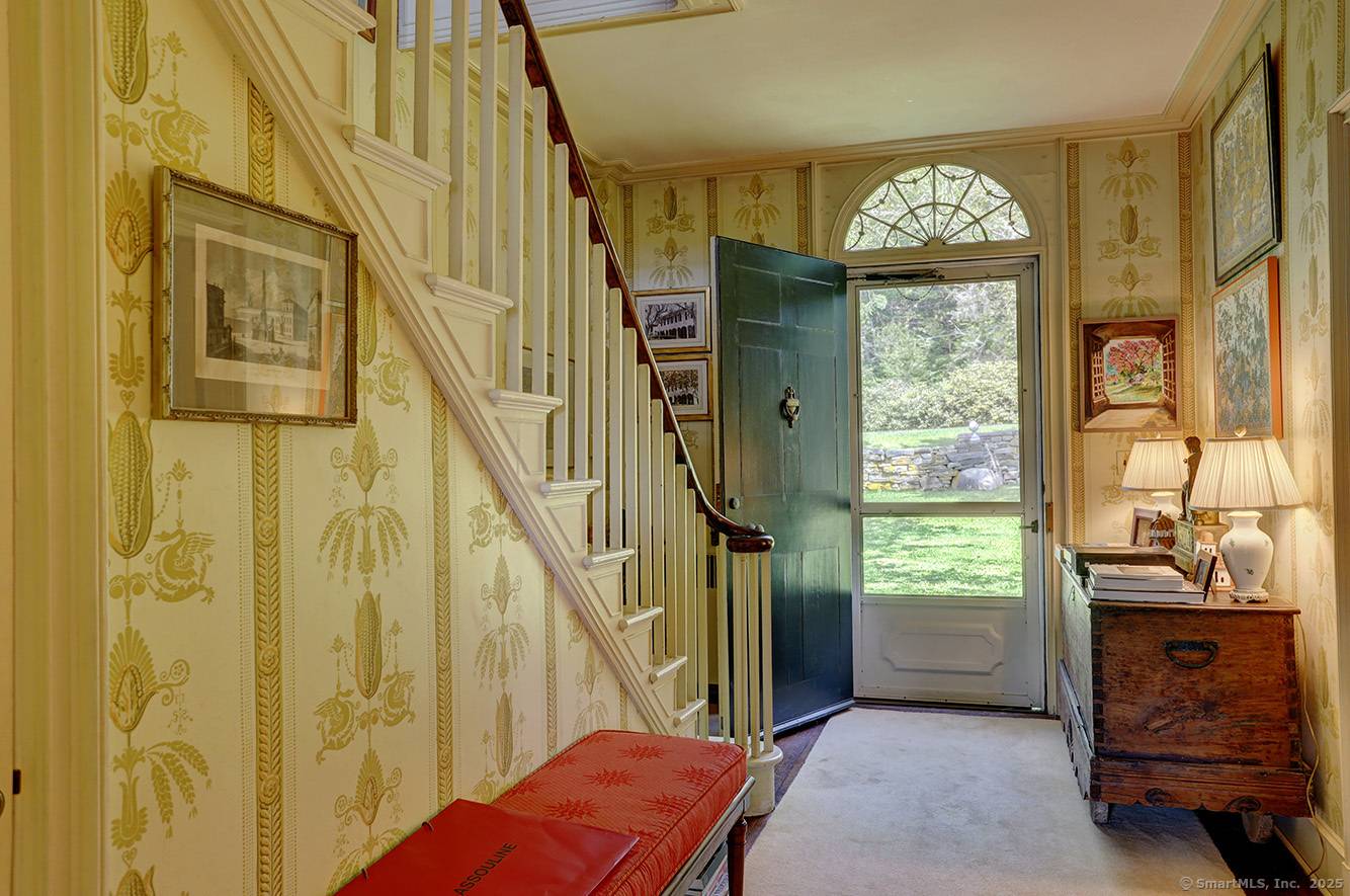 Elegant Torrington House sits on the site of what was once known as Cobble Hill Farm on a total of 95.