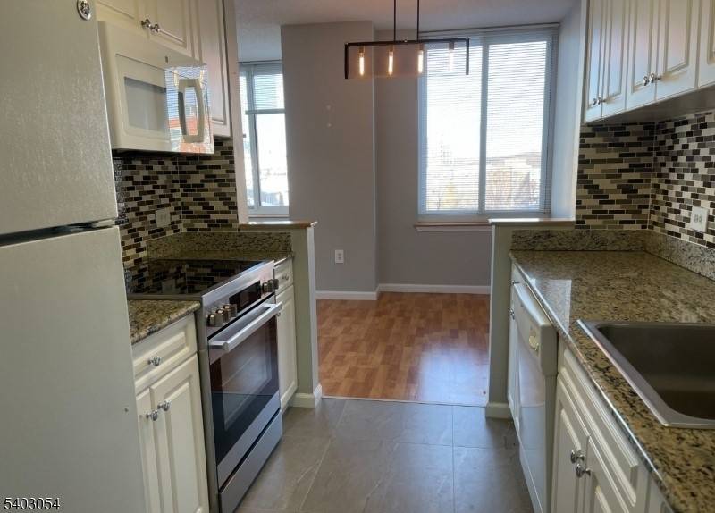 AVAILABLE MARCH 1, 2026. LUXURIOUS HIGH RISE CONDOMINUM located in the PRESTIGIOUS and desirable community of OLD PALISDE with BRIDGE VIEWS.