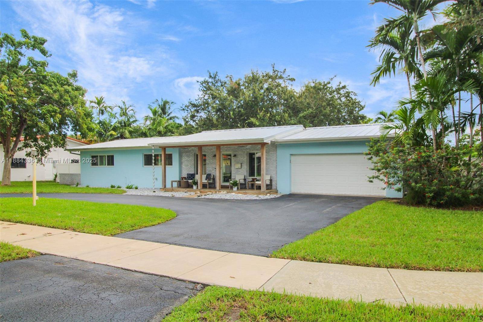 Renovated 4 bed, 3 bath home on an oversized 15, 000 SF corner lot w 2 car garage in desirable Miami Springs.