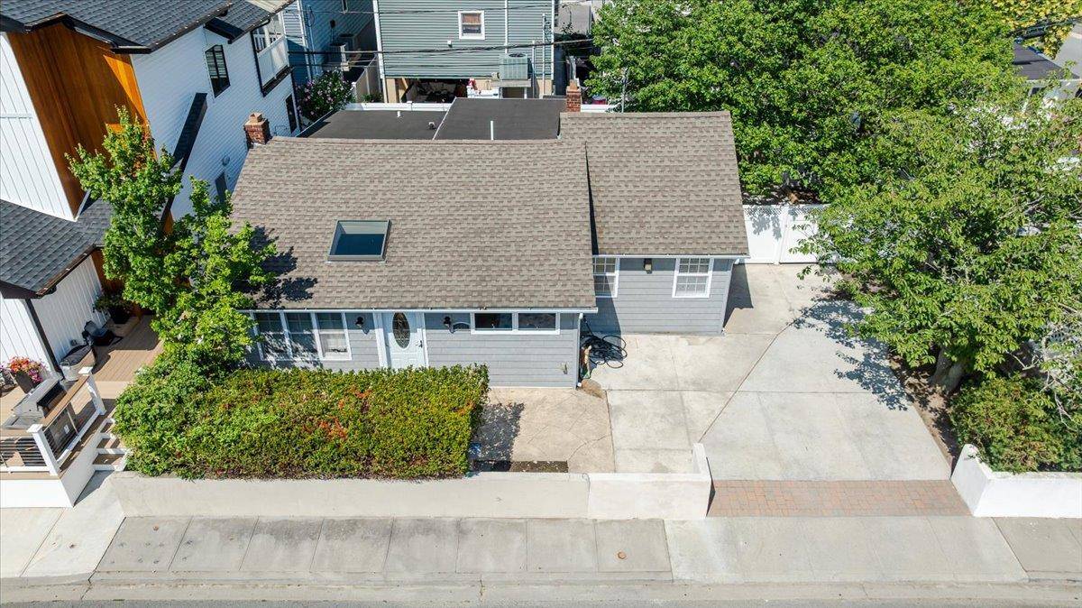 Welcome to this oversized ranch perfectly situated on a rare double lot in the highly sought after West End of Long Beach.