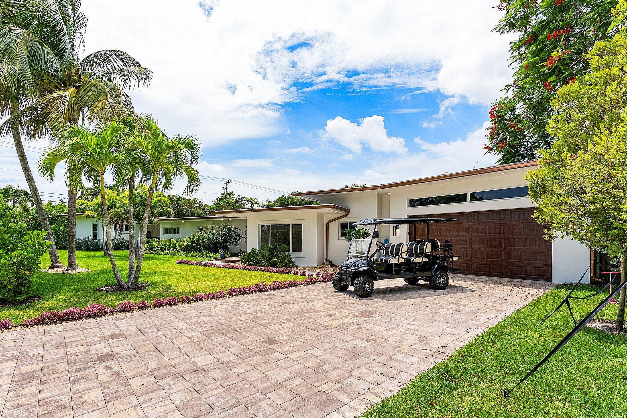 Tucked away on an oversized lot in the heart of Delray Beach's beloved Lake Ida neighborhood, 400 Kings Lynn is a stunning example of Mid Century Modern design reimagined for ...