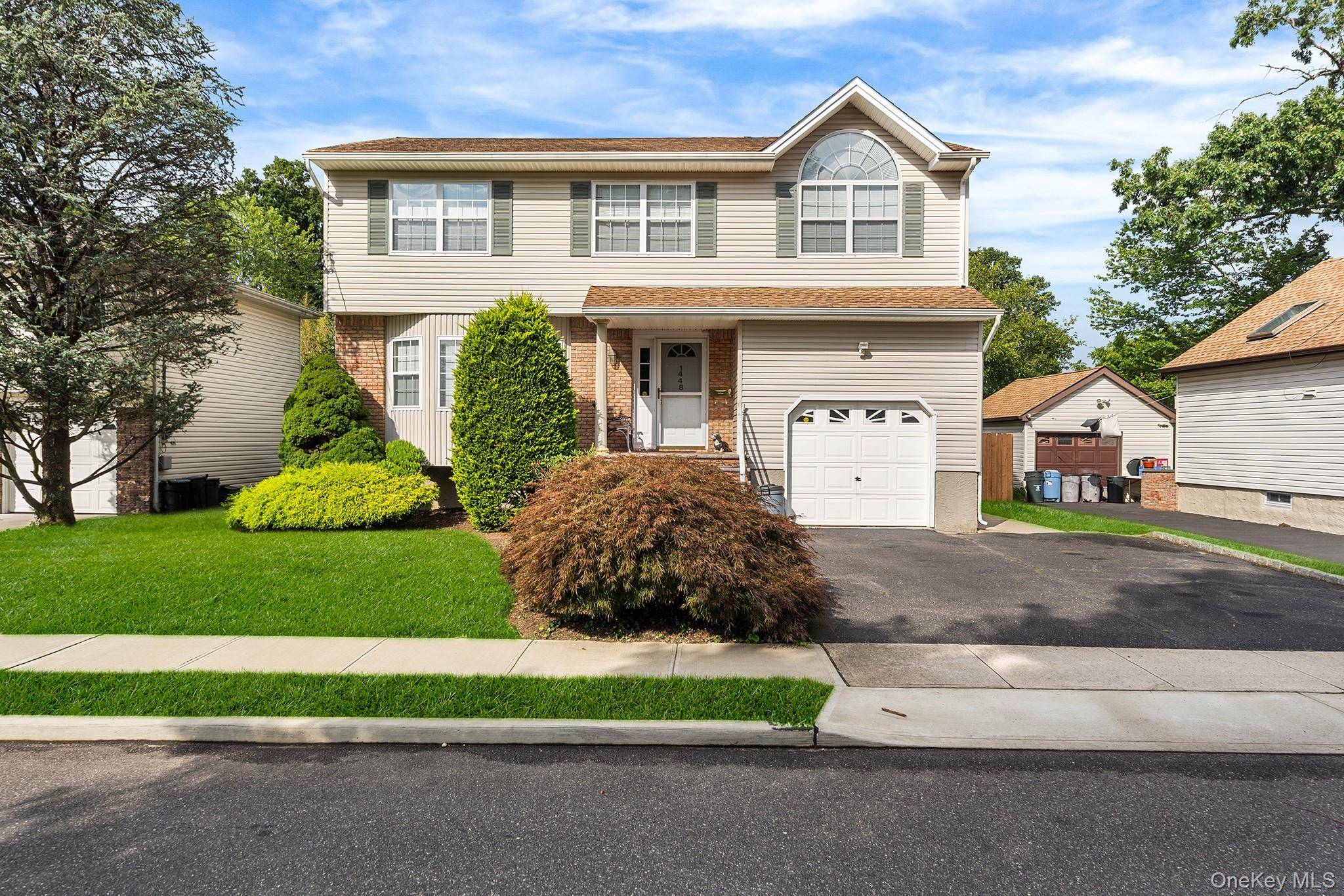Discover this spacious and well appointed home in North Bellmore, offering a blend of comfort and convenience.