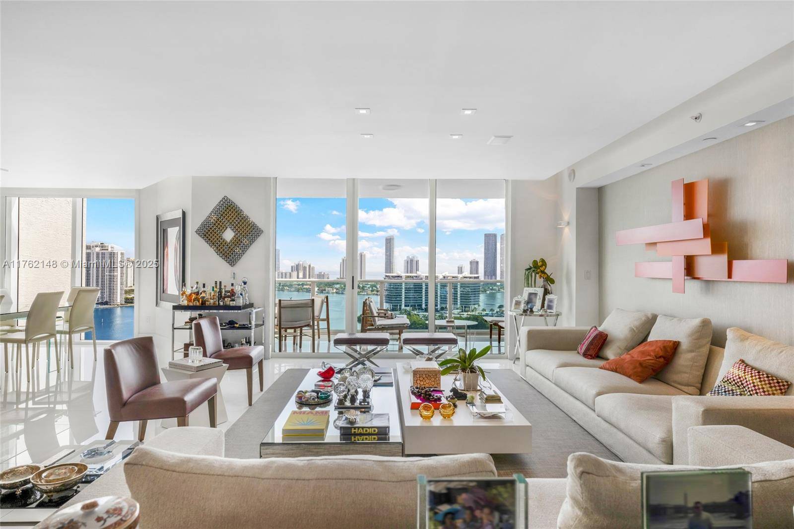 Stunning designer residence at Peninsula II Residence 2406 showcasing dramatic 180 bay to ocean views from a coveted high floor.