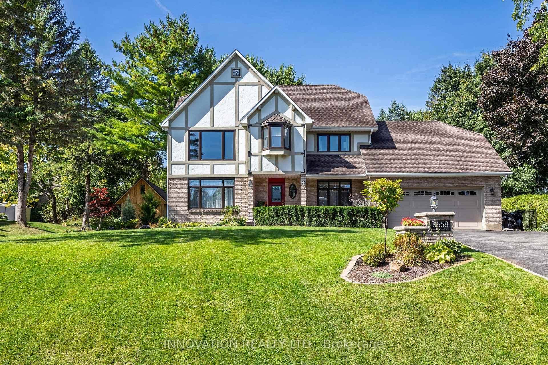 Located on one of Manotick's most sought after streets and surrounded by prestigious multi million dollar residences, this elegant family home combines timeless charm with modern comfort.