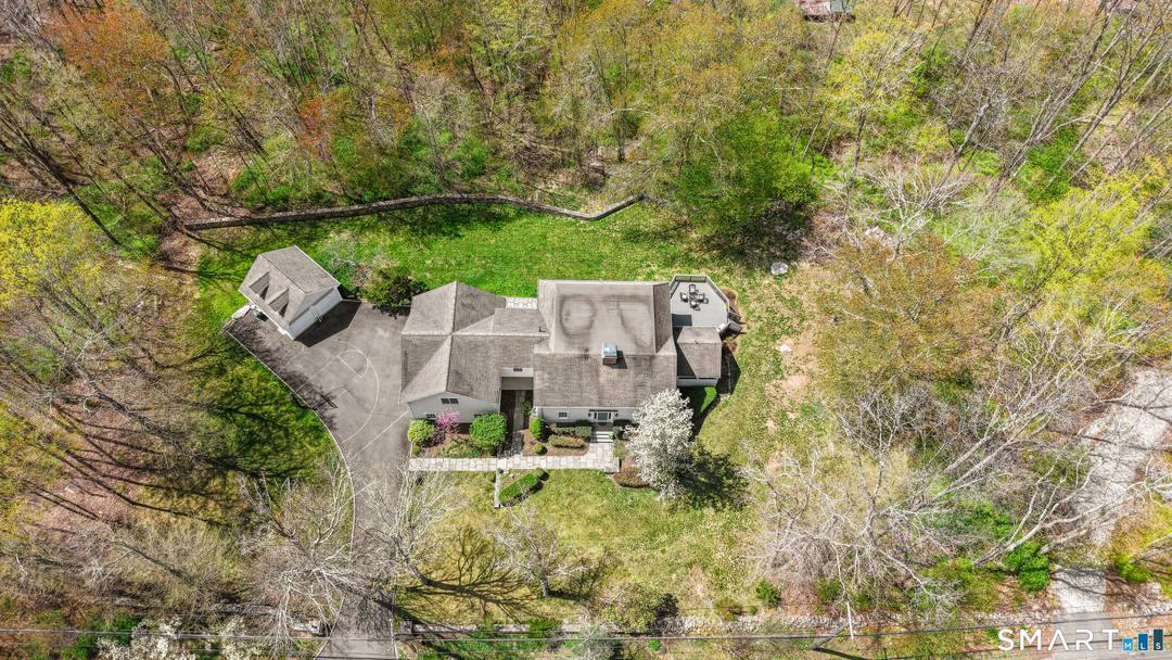 Set on 3. 23 acres in the Greenfield Hill area of Fairfield, this 5BR, 4BA home offers privacy, natural surroundings, a layout designed for the way we live today.