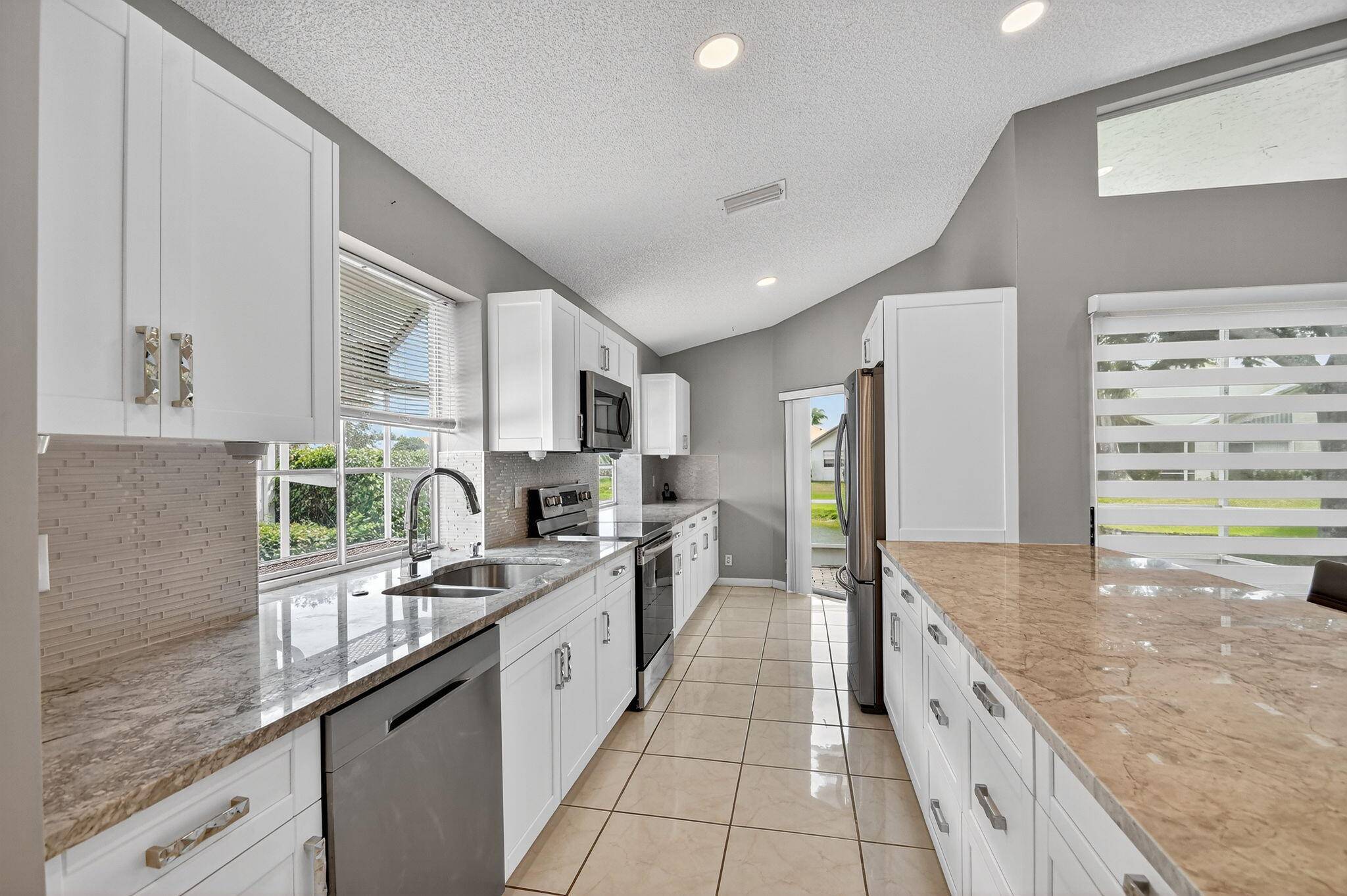Welcome home to this Beautiful 3 bed, 2 bath lakefront home in the fabulous low HOA 55 community of LAKERIDGE !