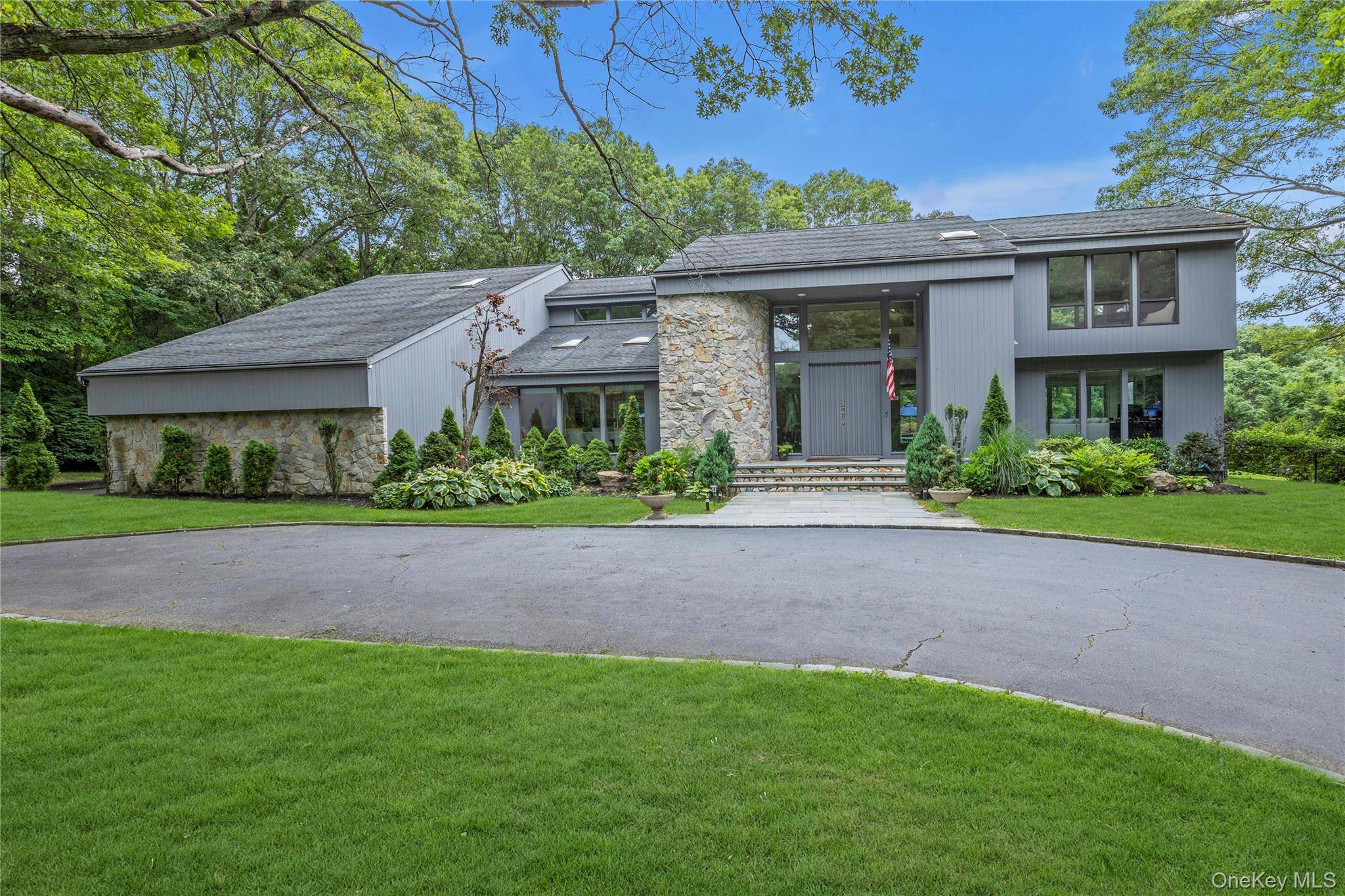 Tucked away at the end of a serene cul de sac, this spectacular modern retreat is situated on 2.