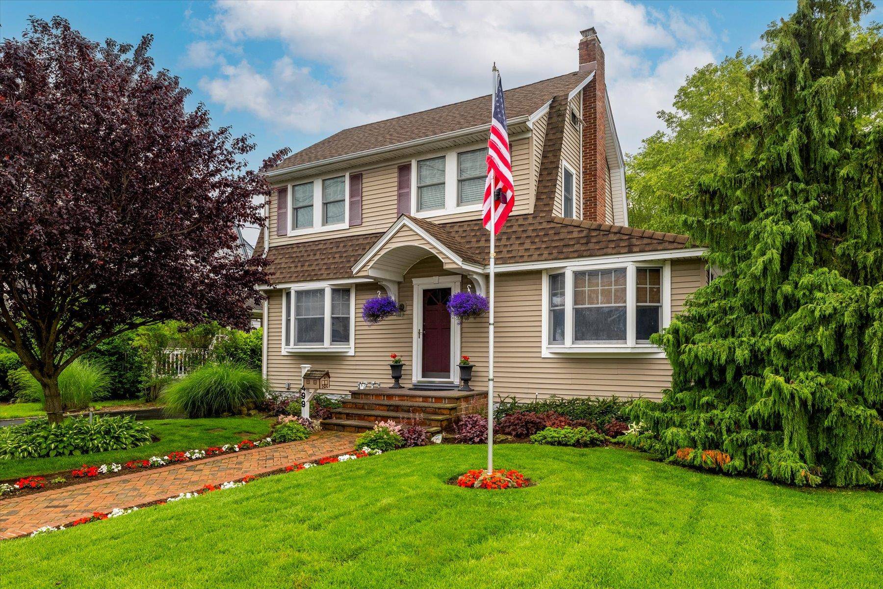 Pride of ownership is immediately evident in this meticulously maintained Colonial home.