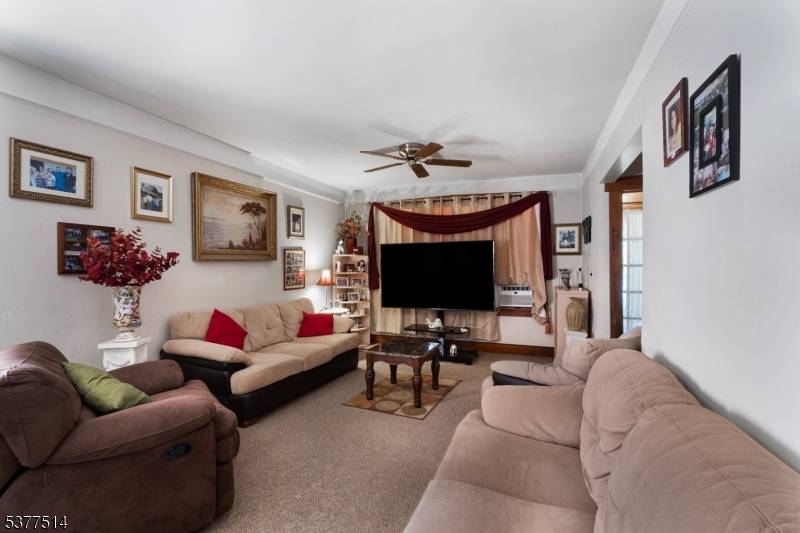 Expanded, oversized two unit house with a finished attic and basement.