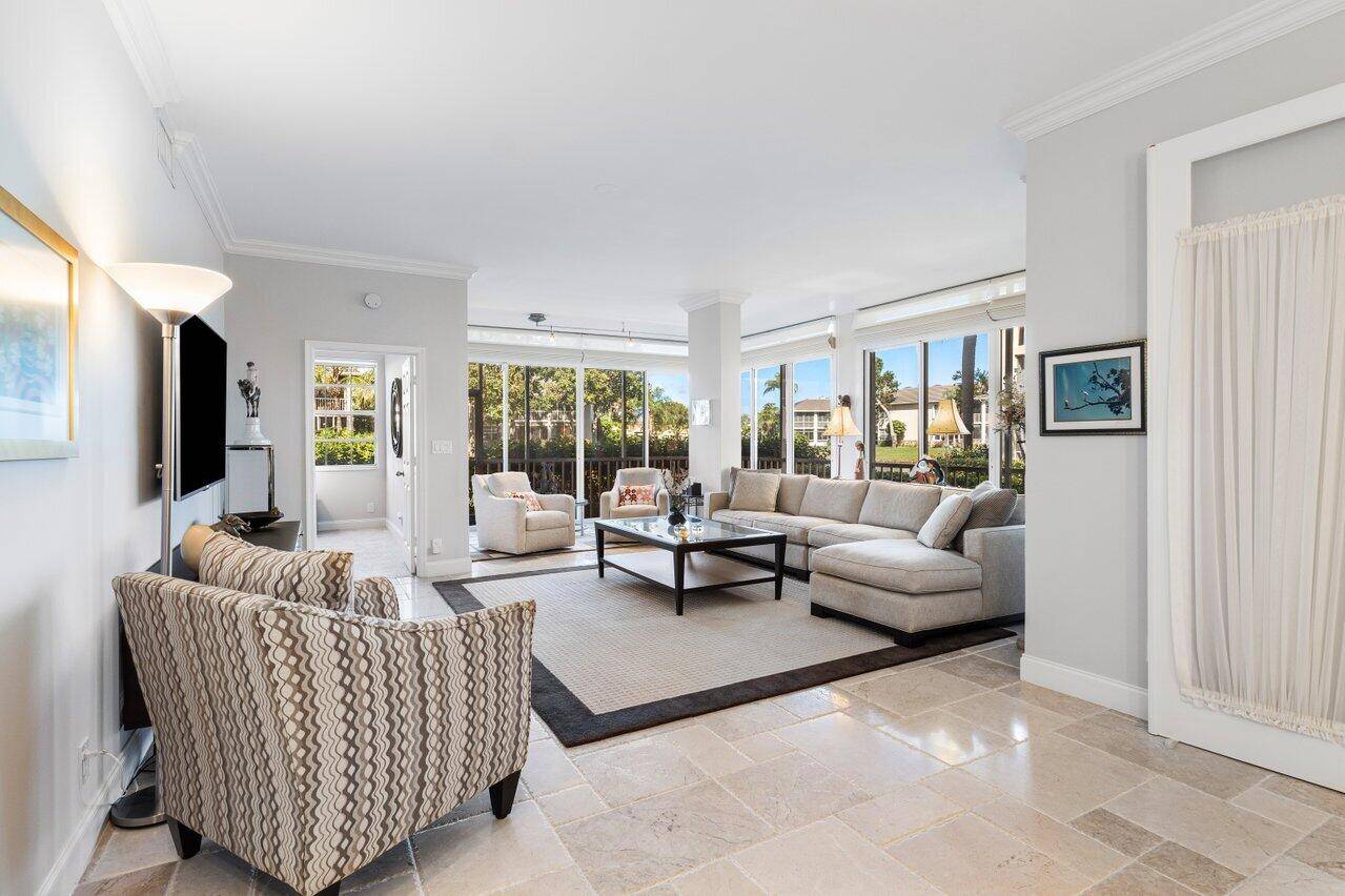 Bright and inviting ground floor condo with stunning lake views !