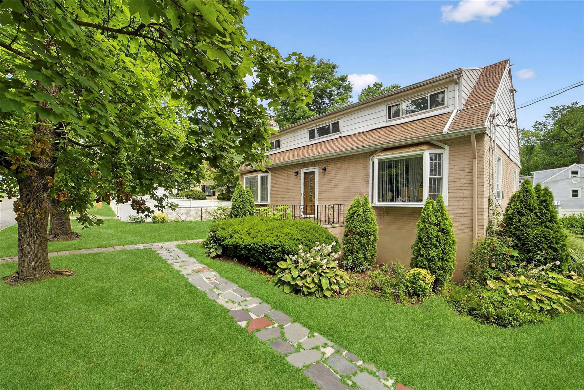 Discover this well maintained two family brick colonial offering timeless charm and strong investment potential.