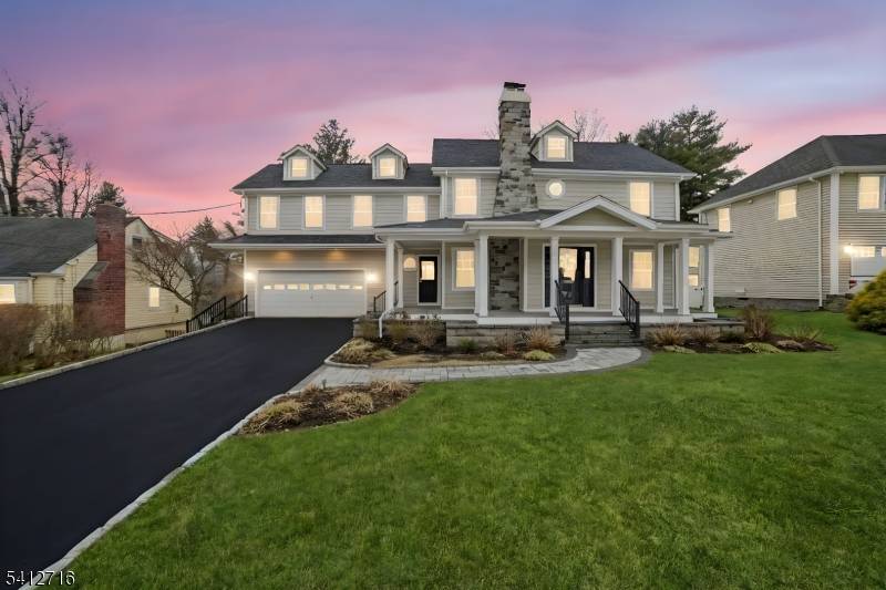 Beautifully Renovated Custom Colonial with a Welcoming Wrap Around Porch, located on a quiet, dead end street.