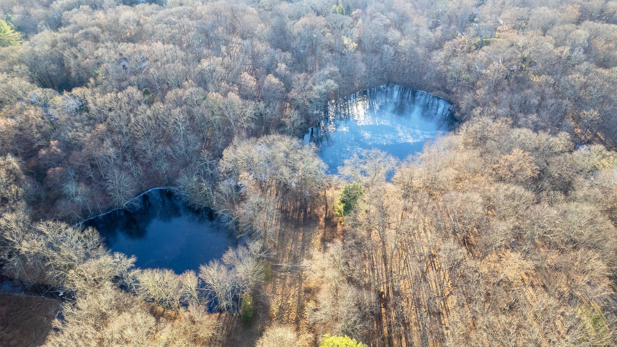 27 acres of serene land along the Aspetuck River spreading between Fairfield and Weston.