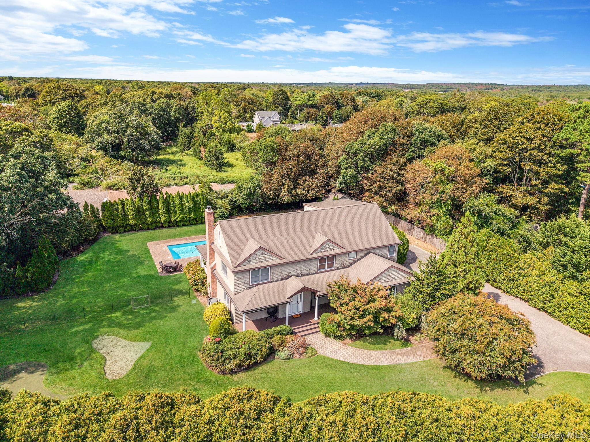 OFFERED AS OFF SEASON RENTAL NOT YEAR ROUND Welcome to 32A Vail Ave, East Quogue, your spectacular East Quogue seasonal retreat with 4, 442 sqft designed for endless summer living.