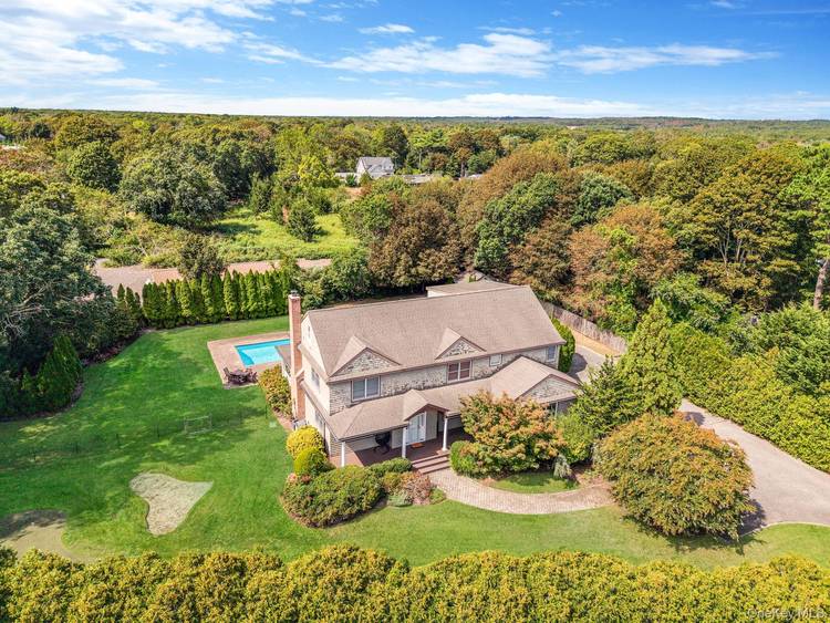 OFFERED AS SEASONAL RENTAL NOT YEAR ROUND Welcome to 32A Vail Ave, East Quogue, your spectacular East Quogue seasonal retreat with 4, 442 sqft designed for endless summer living.