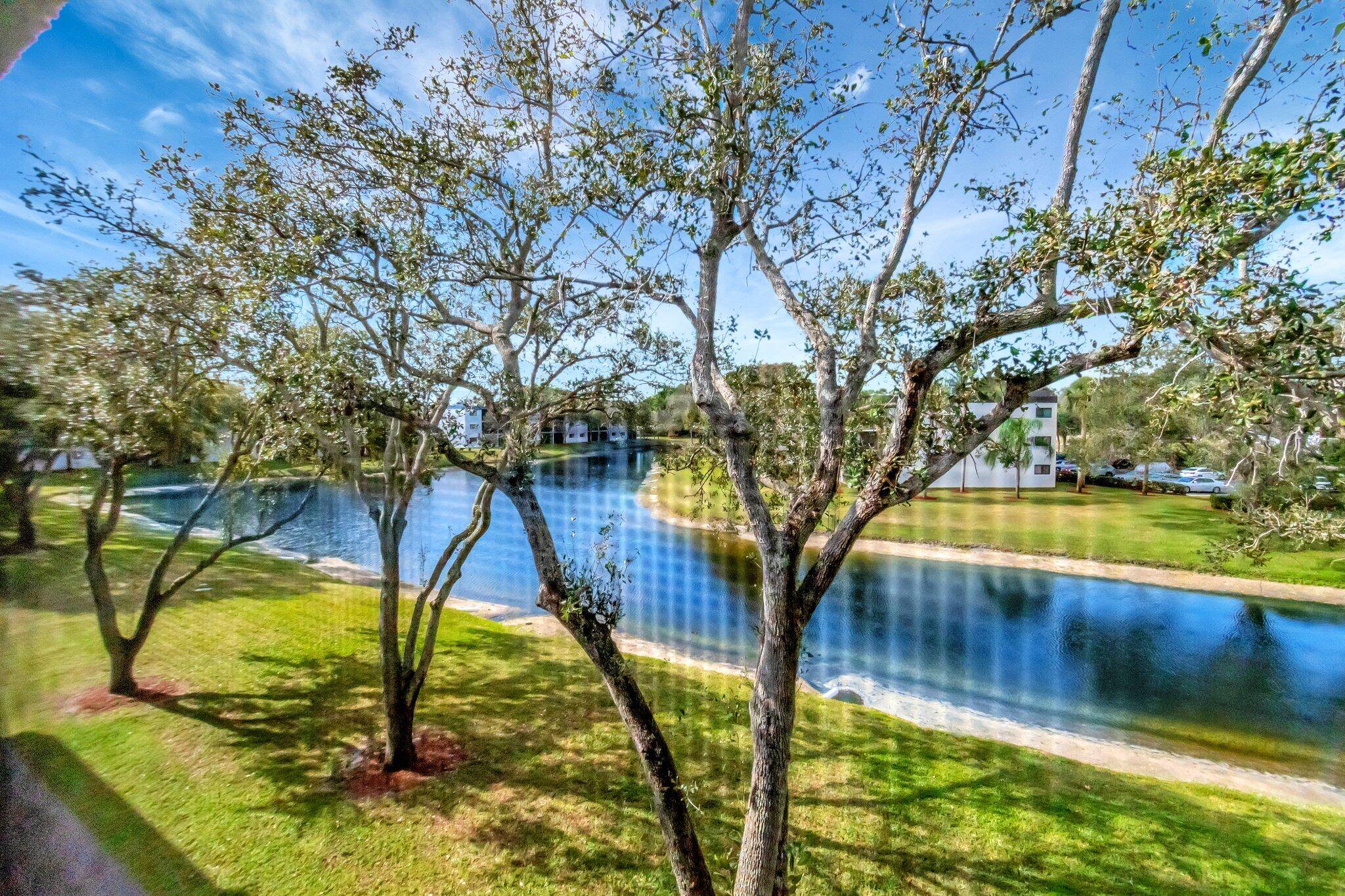 Spacious 1, 348 Sq Ft Third Floor Elevator Building Unit with Lovely Long Lake Views from your Primary Bedroom, Enclosed Patio and Living Room.