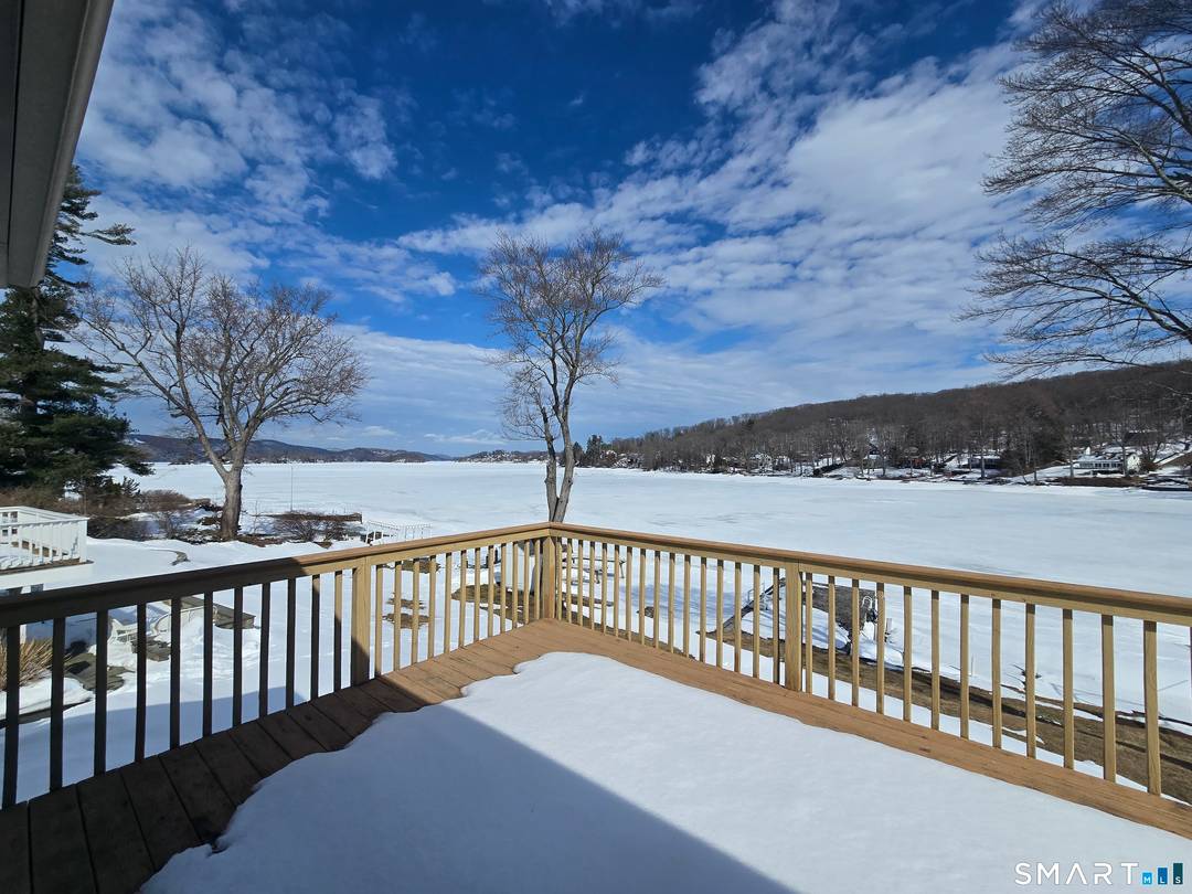 Candlewood Lake direct waterfront home with sweeping 180 degree views and gentle, easy access right to the water.