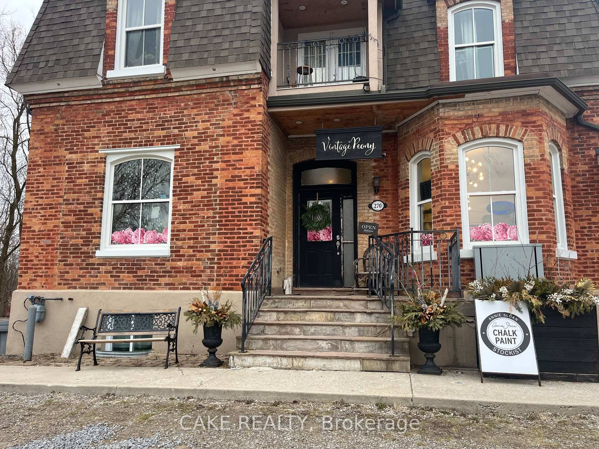 Schomberg prime retail office mixed use or residential unit available on Main street in a beautiful red brick building originally the train station Inn.