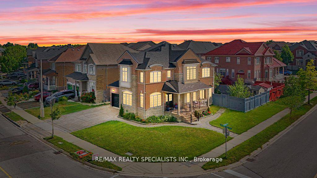 Absolutely Stunning Sun Filled Corner Lot Home Featuring a Stone amp ; Brick Exterior with Double Door Entry !