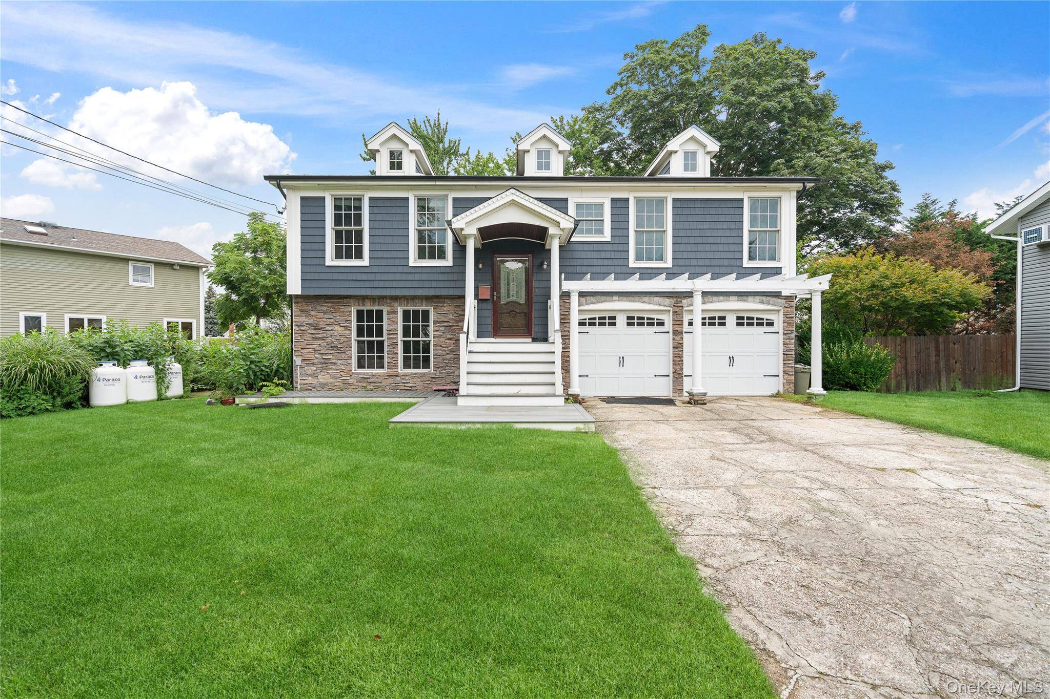 Immaculate and freshly painted, this hi ranch with 3 bedrooms, kitchen and dining room has it all !