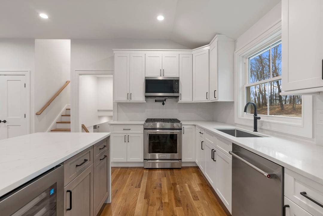 Completely remodeled with new additions, versatile living spaces and elevated finishes, this redesigned farmhouse split is truly turn key and feels like a brand new home.