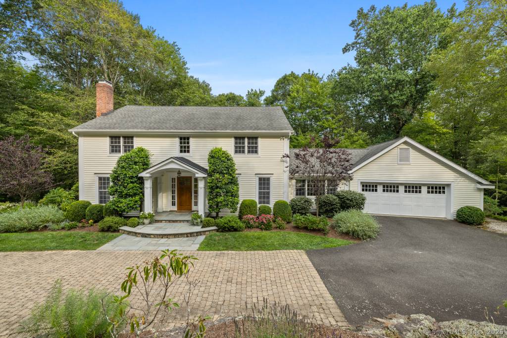 Tucked at the end of a cul de sac, this 4BR Colonial blends the friendly neighborhood feel with privacy.