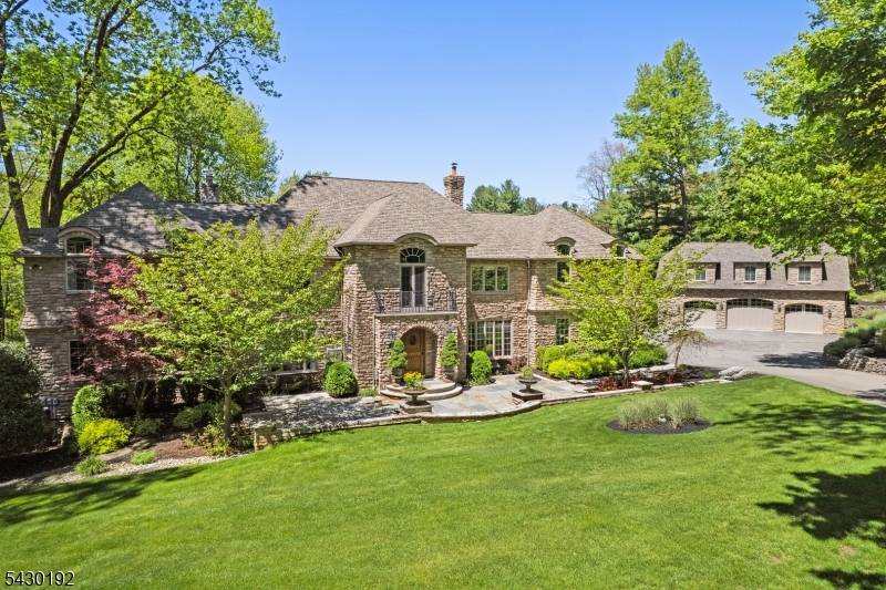 Welcome to Stonecroft a magnificent all stone Custom Home modeled after an enchanting French manor house replete with gated driveway, carriage house, and private pond and set back beautifully on ...