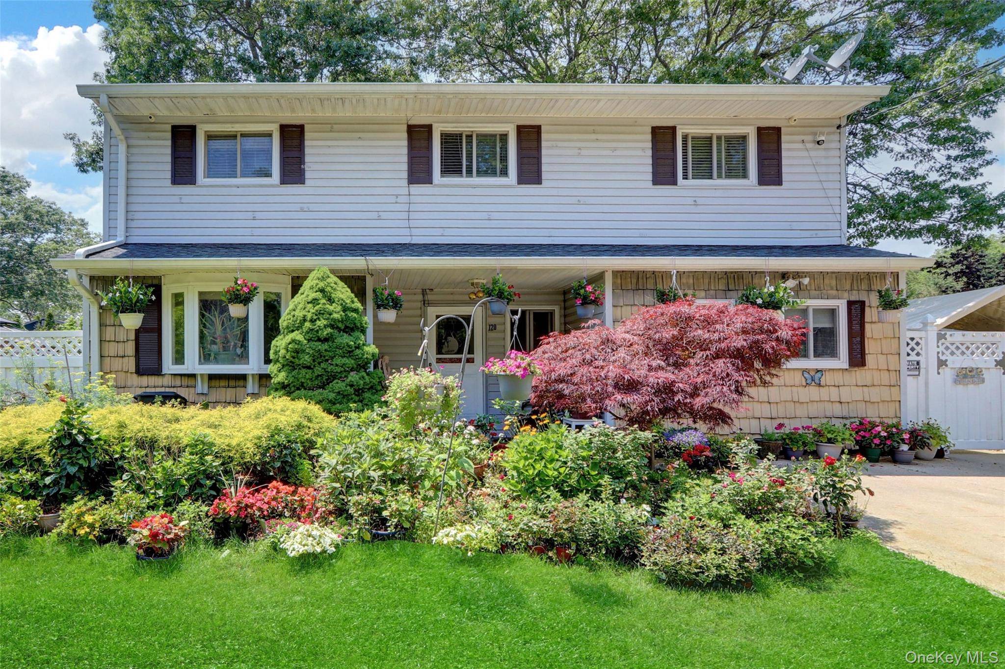 Spacious Colonial 4 beds 3 baths, Multi family mother daughter with permits, huge backyard with beautiful landscape, end road with quiet and privacy, most desired Sachem school district, close to ...