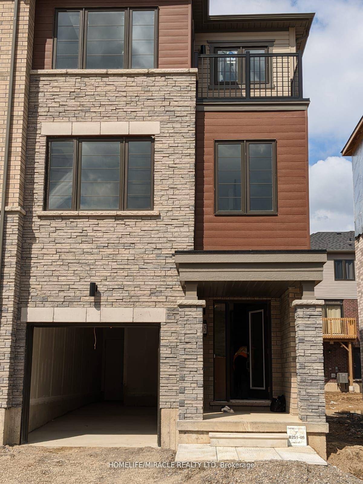 Welcome to 215 Gillespie Drive A Stunning End Unit Freehold Townhome in West Brant !