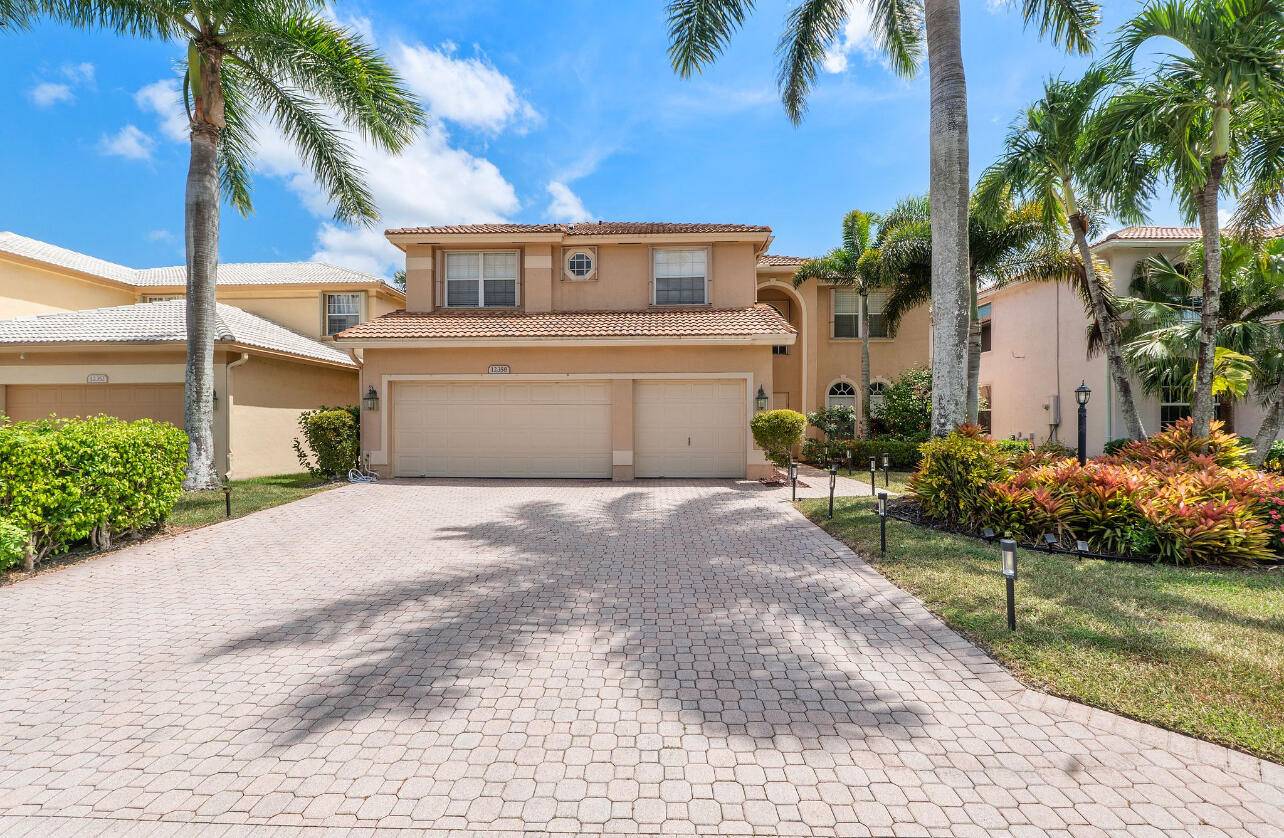 Move in ready and fully updated 5BR 4BA home in Boca Winds !