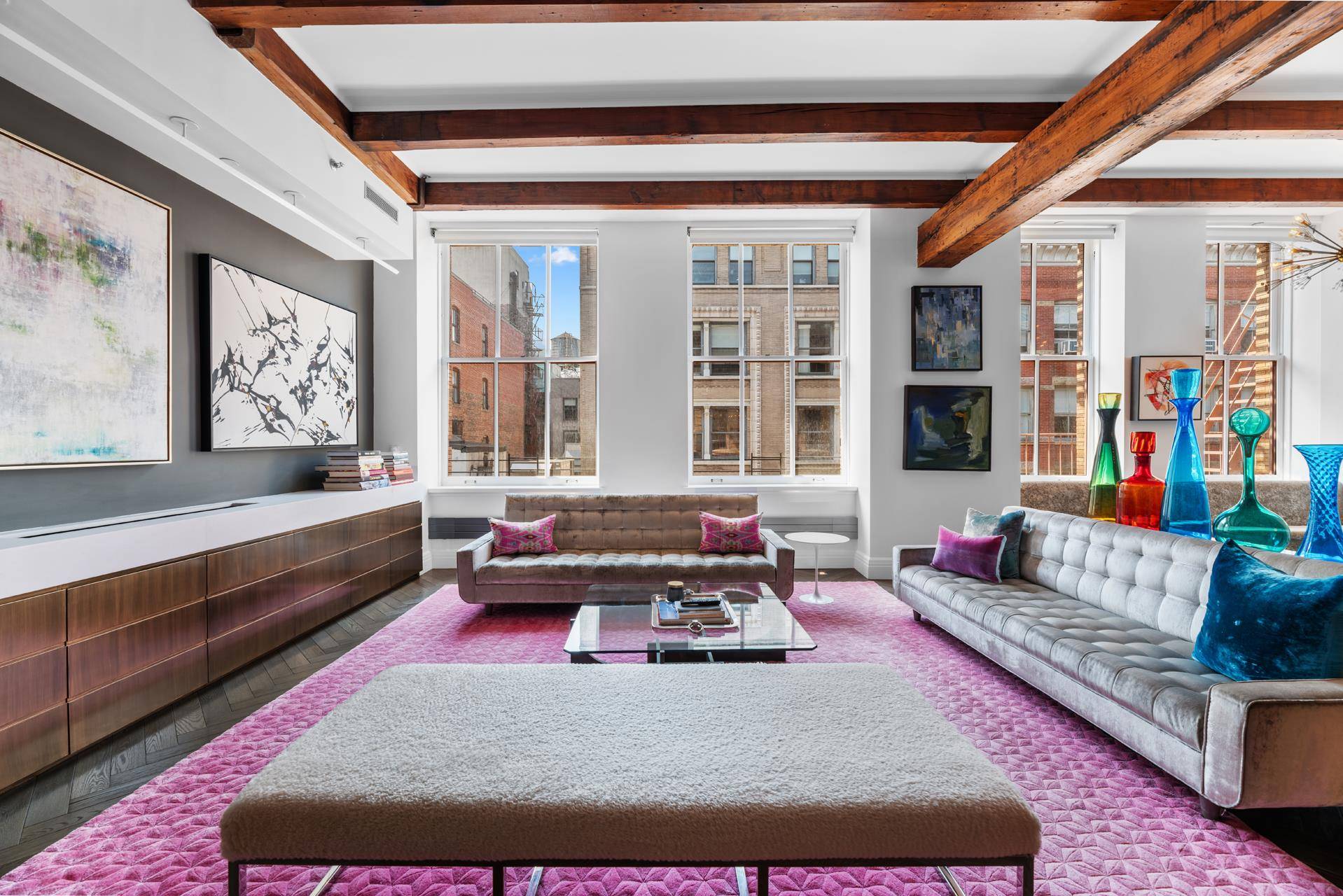 Experience the allure of an authentic pre war SoHo loft with intricate detailing and modern charm in Unit 4S at 104 Wooster Street.