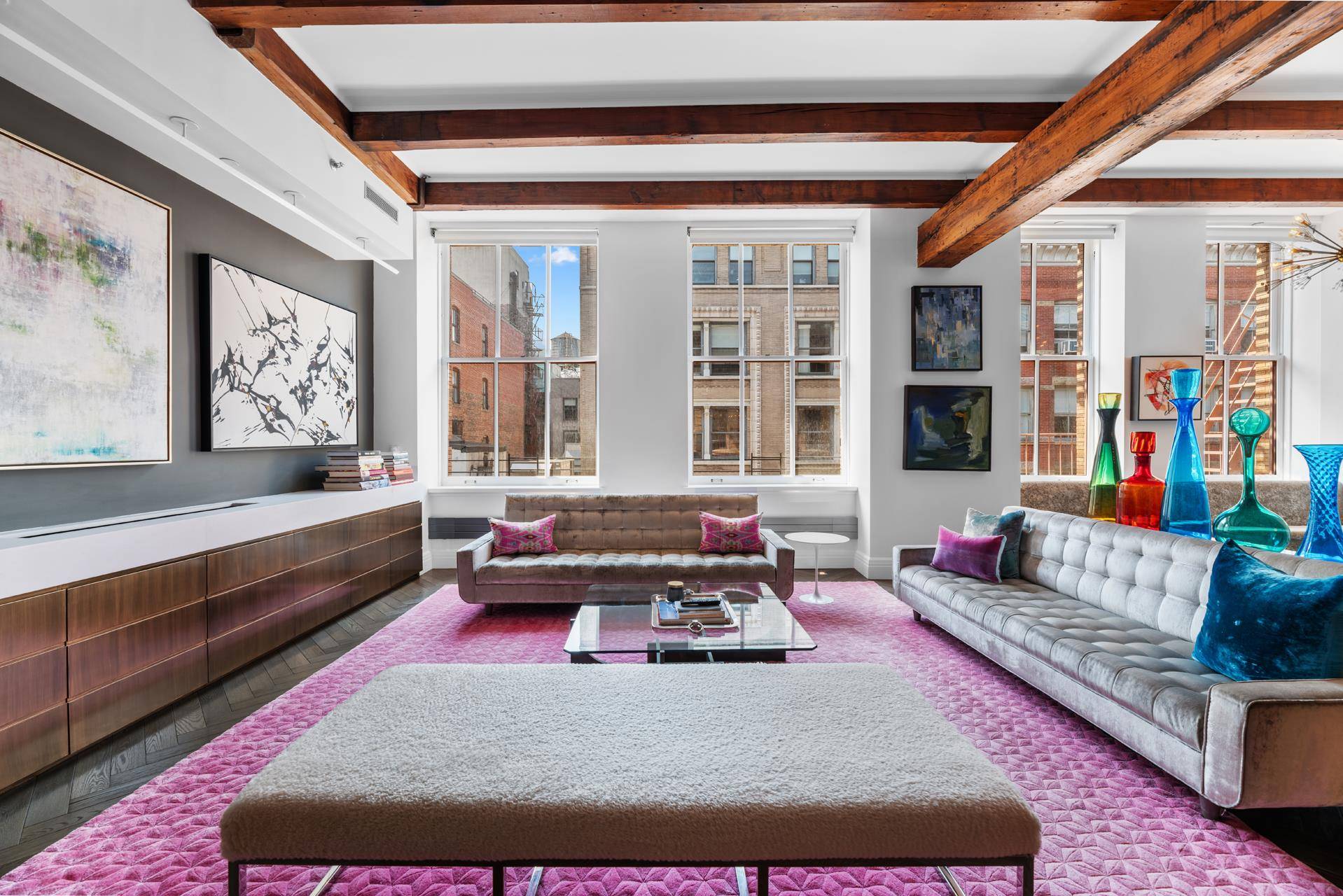 Experience the allure of an authentic pre war SoHo loft with intricate detailing and modern charm in Unit 4S at 104 Wooster Street.