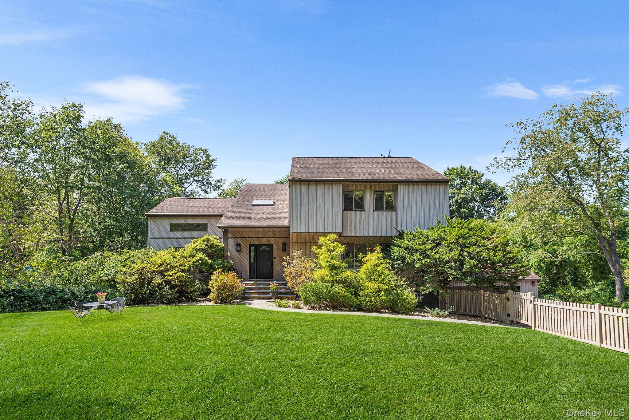Beautifully updated and thoughtfully maintained, this home offers a private, expansive yard with mature trees, major landscaping improvements, and a newly added front yard fence.
