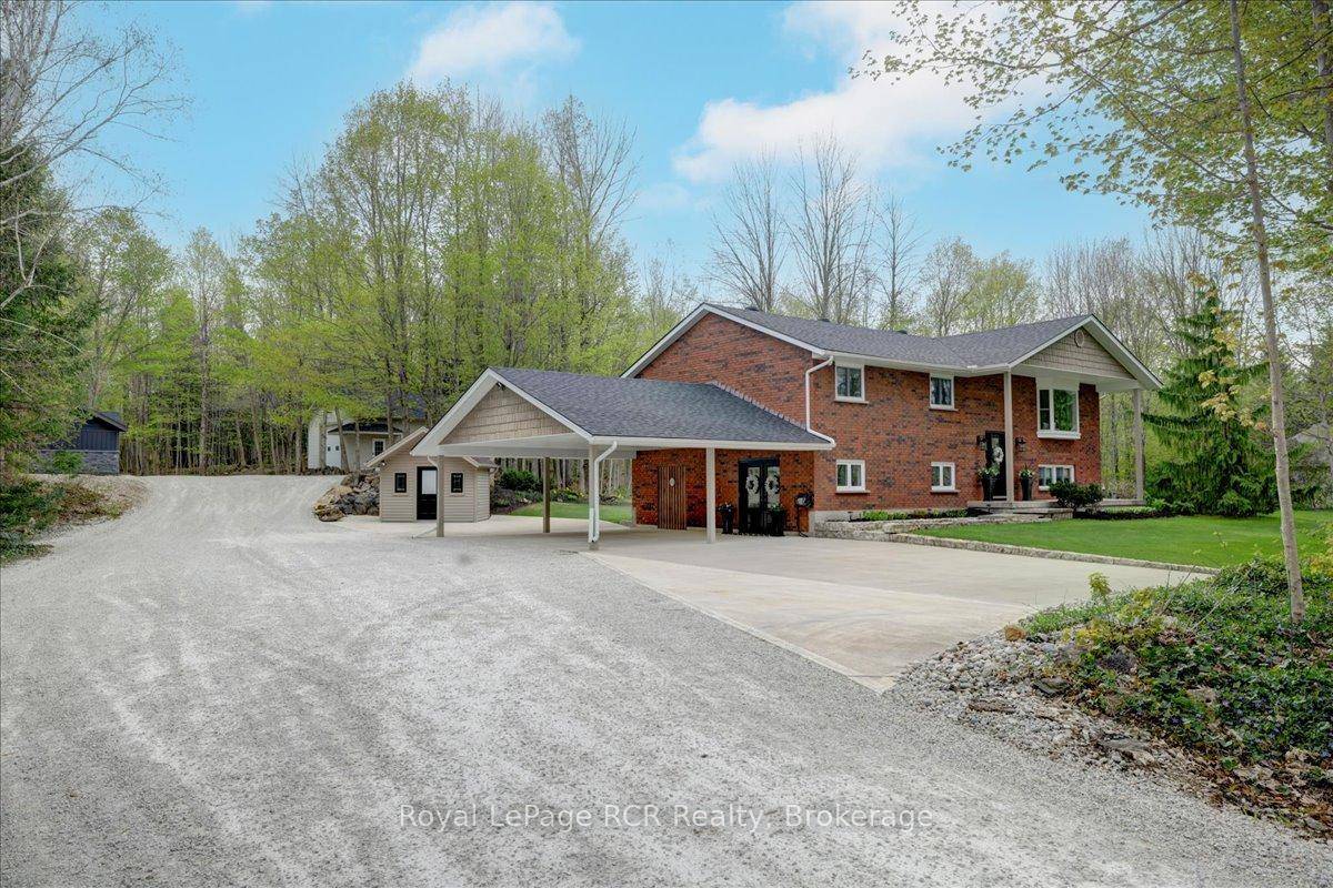 Tucked away on a picturesque 2 acre lot, this fabulous raised bungalow is your own private escape, where comfort, style, and nature come together beautifully.