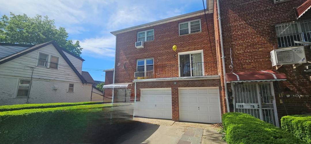 Welcome to this stunning semi attached brick colonial, a rare legal three family gem nestled on a quiet, tree lined street in a sought after Queens neighborhood.