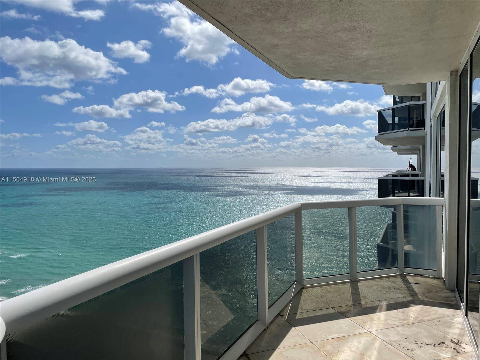 This high floor unit has spectacular unobstructed views of the ocean, the bay and Miami's skyline, with floor to ceiling glass doors from living room kitchen, all connected through an ...