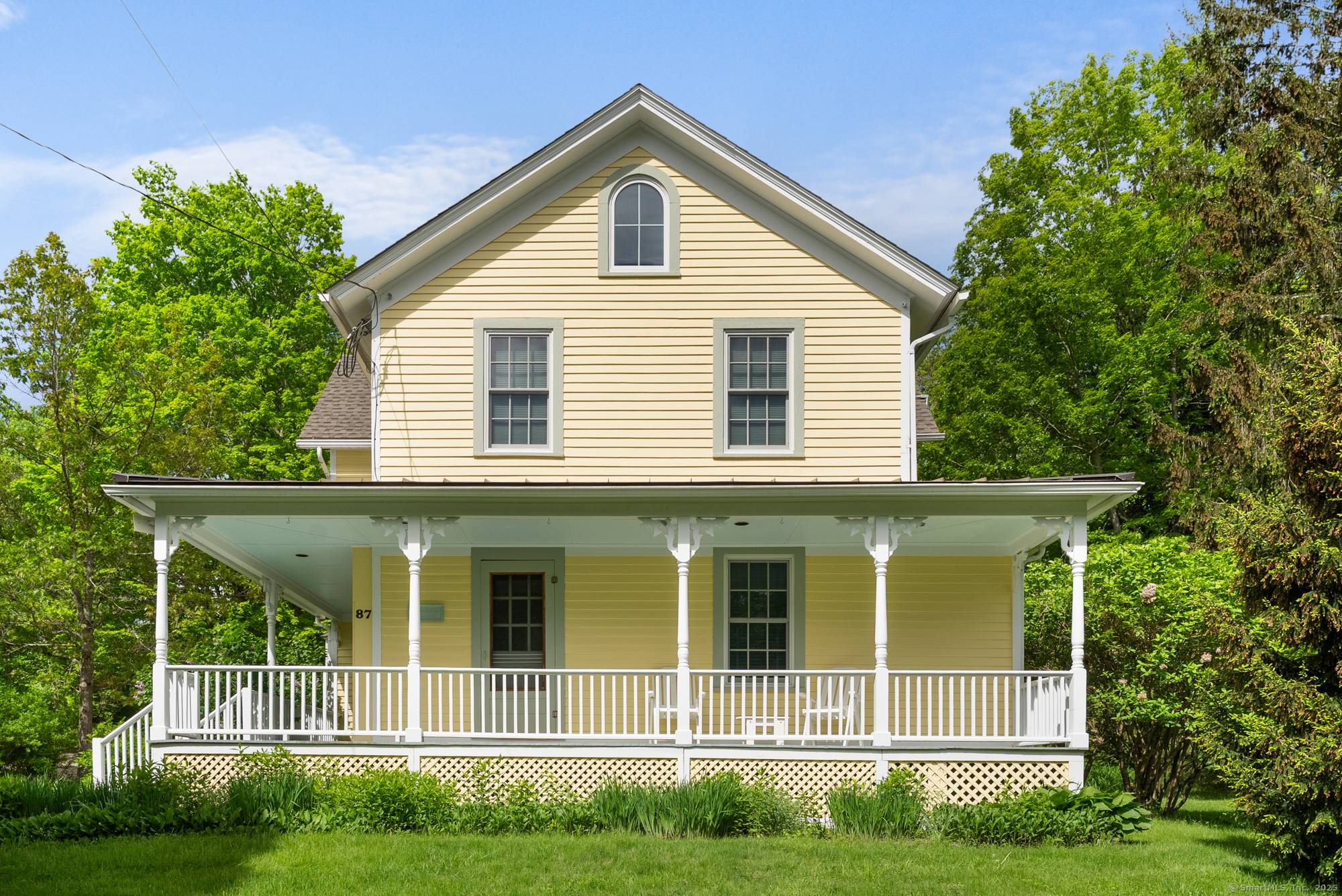 Introducing Thyme Haven Farmhouse, a quintessential New England Colonial surrounded by lush gardens and mature plantings.