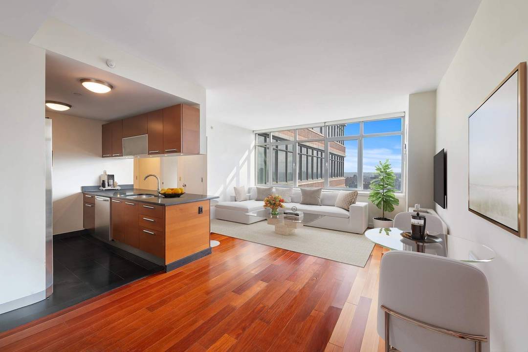Welcome to Residence 22C at 1485 Fifth Avenue a sun drenched one bedroom, one bath home soaring high above East Harlem in a full service luxury building.