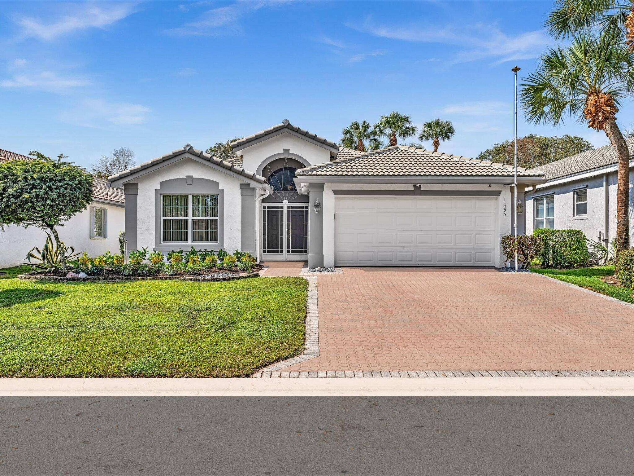 This beautiful Pacific model features a NEW ROOF 2022 and provides the peace security of FULL IMPACT GLASS STORM PROTECTION and a HURRICANE RATED GARAGE DOOR.