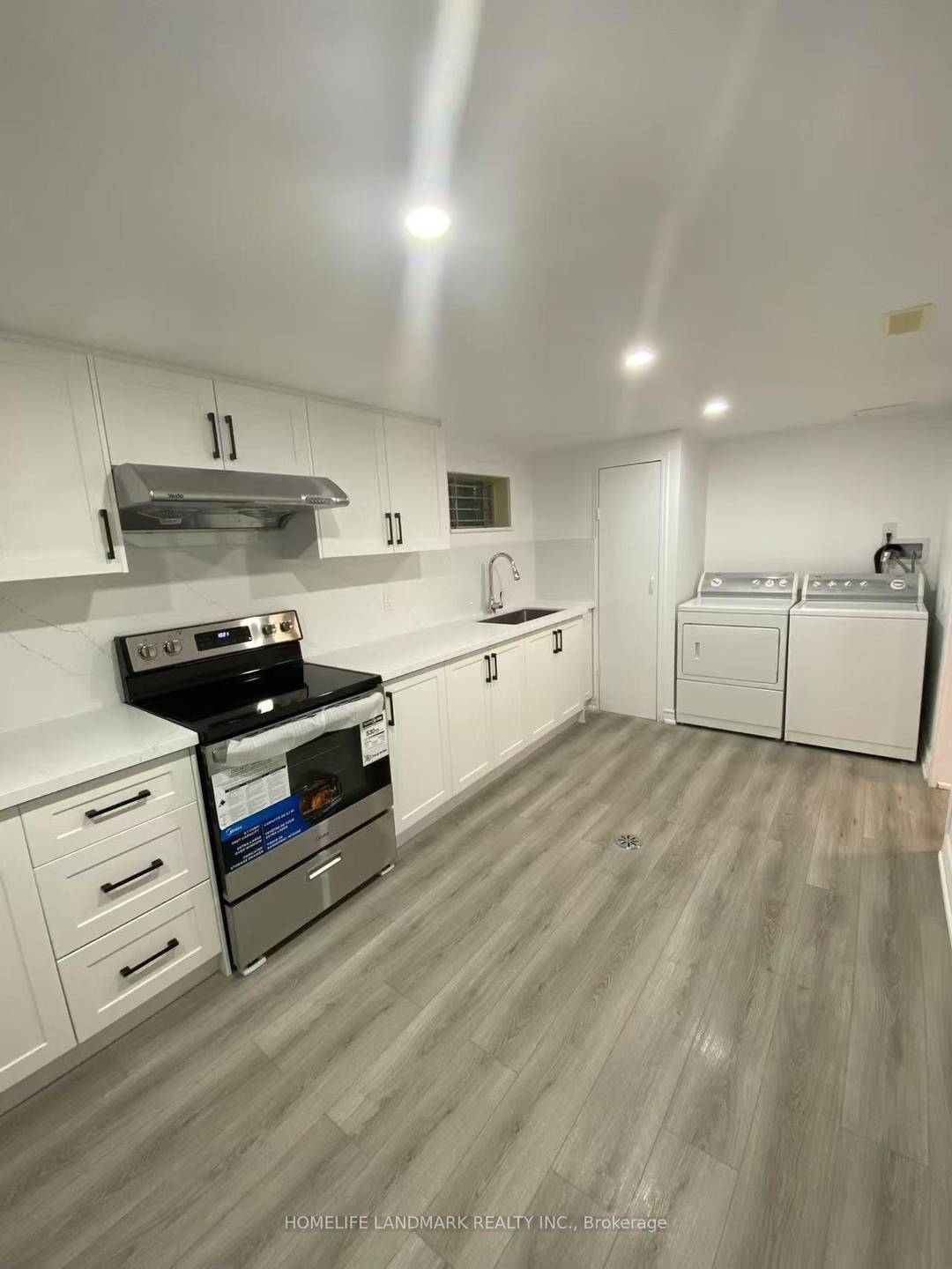 Newly renovated kitchen and living room, 2 Spacious Bedrooms above grade and beautiful backyard with back door to the Park.