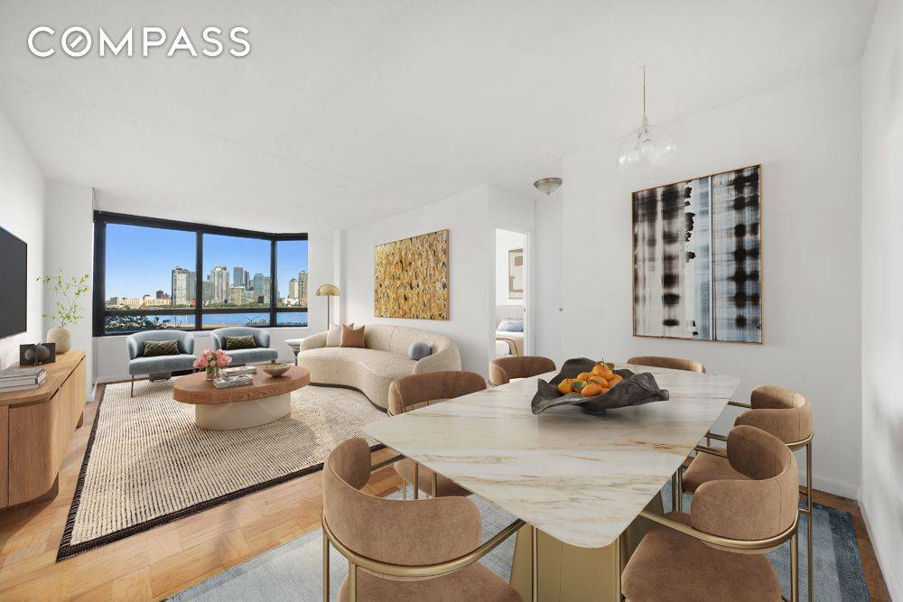 This spacious one bedroom, one bath residence offers unobstructed views of the East River framed by wall to wall windows that bathe the interiors in natural light.