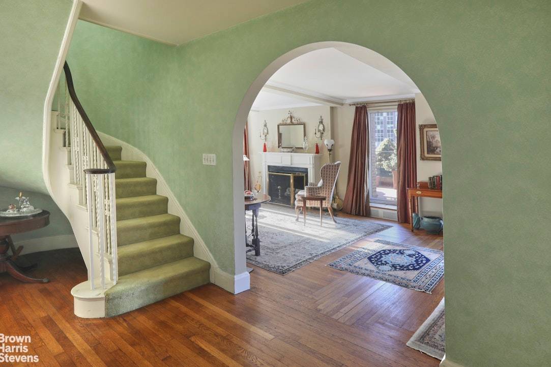 On the first level, an inviting foyer leads to a spacious living and dining area.