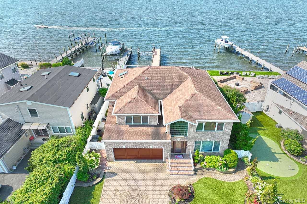 Welcome to 83 Fairwater, a young home with panoramic views of the Great South Bay, perfectly situated in desirable Nassau Shores.