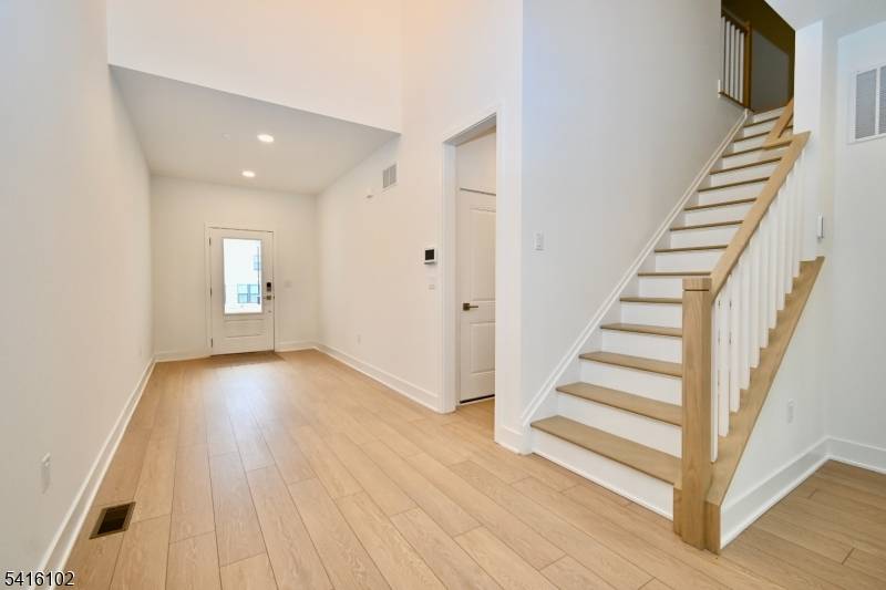 Welcome to 26 Arowana Road, a stunning new construction luxury townhome by Toll Brothers located in the highly sought after Oaks at Randolph community that is ready to move in.