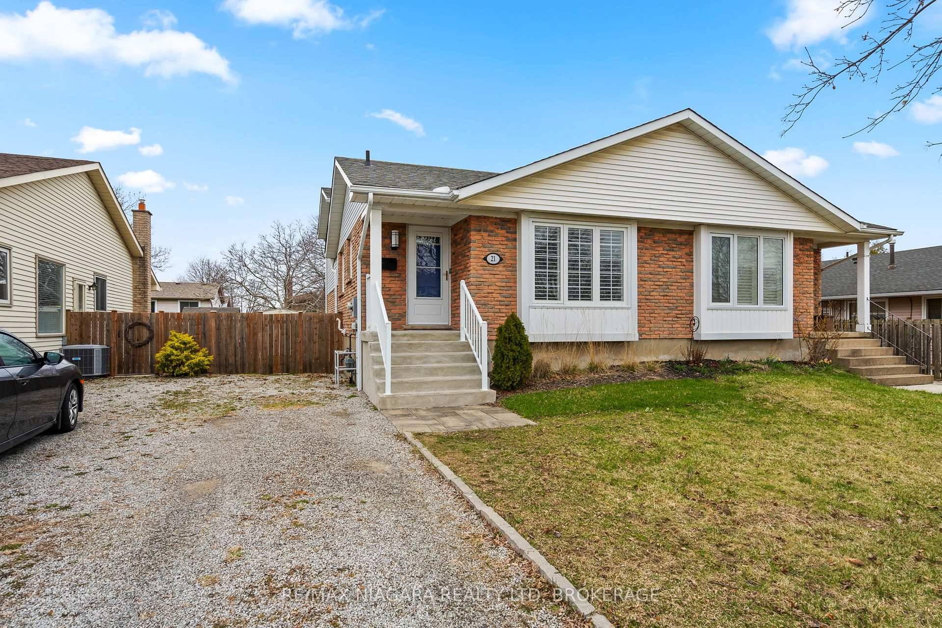 This beautifully updated home features fresh paint, newer flooring, baseboards, doors, and hardware throughout.