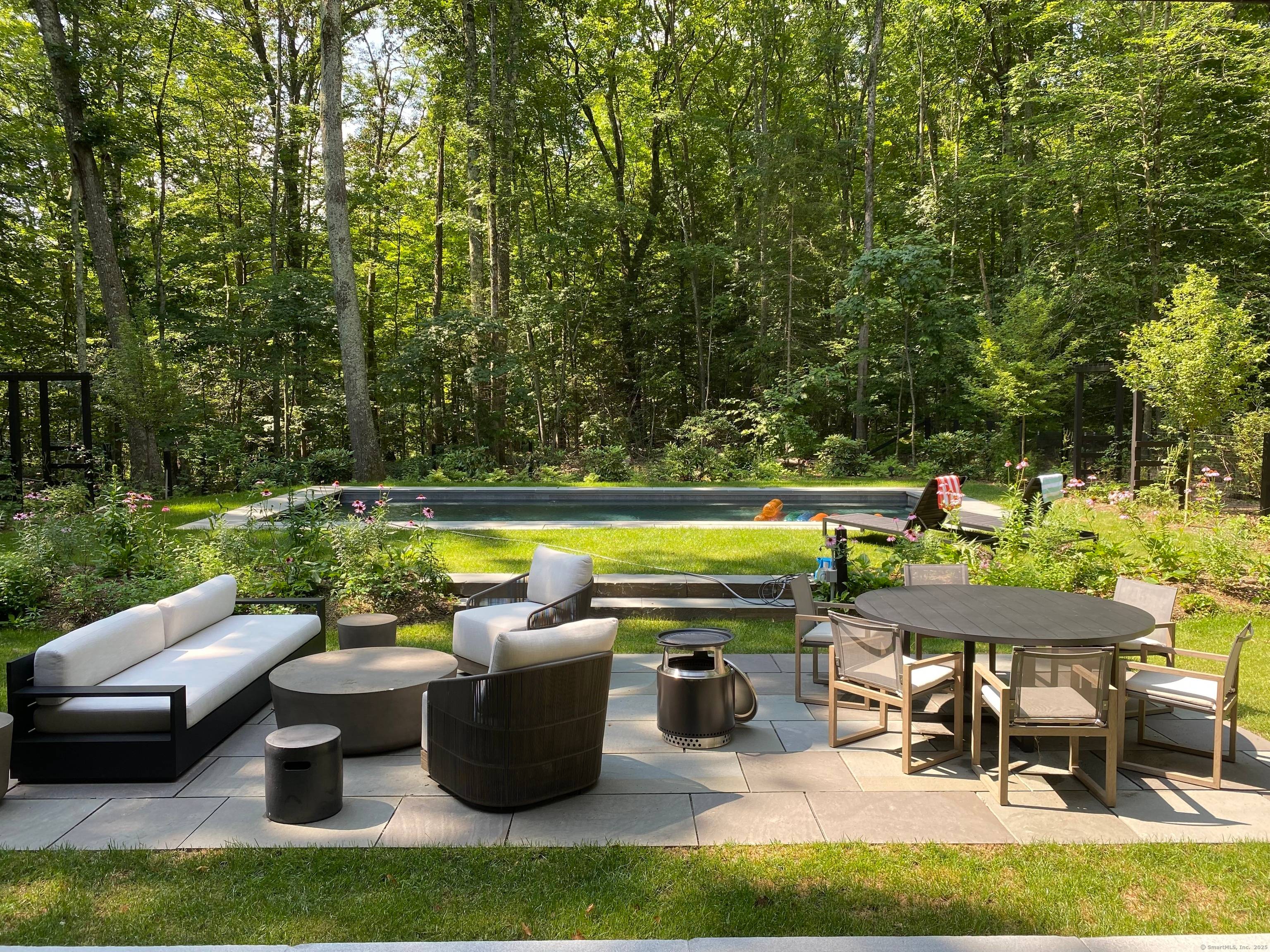 Available August 2025 Just moments from the picturesque town of Salisbury, this private summer retreat is a masterpiece of contemporary design by premier architect StoneFox.