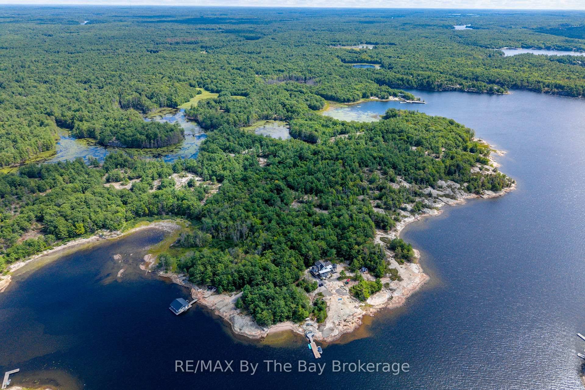 This property is truly a private paradise on the clear waters of Georgian Bay, where 20 spectacular acres of trees, granite and over 1700 feet of waterfront await your arrival.